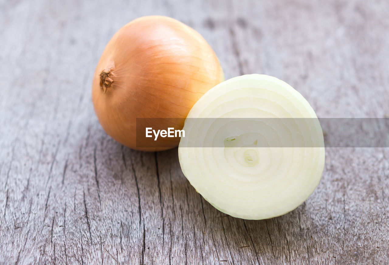 High angle view of onion on wooden table