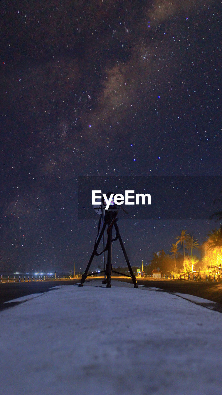 Satellite against sky at night
