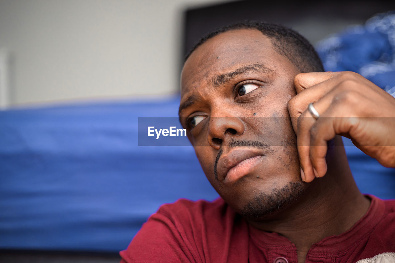 adult, portrait, one person, men, headshot, person, lifestyles, indoors, mature adult, front view, serious, exercising, emotion, sports, human face, looking at camera, close-up, beard, looking, facial hair, relaxation, focus on foreground, senior adult, contemplation, casual clothing, copy space, athlete, strength, hand