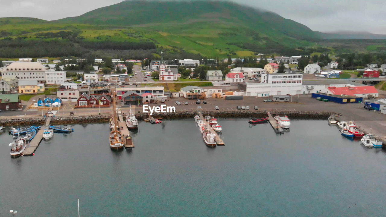 HIGH ANGLE VIEW OF HARBOR BY SEA