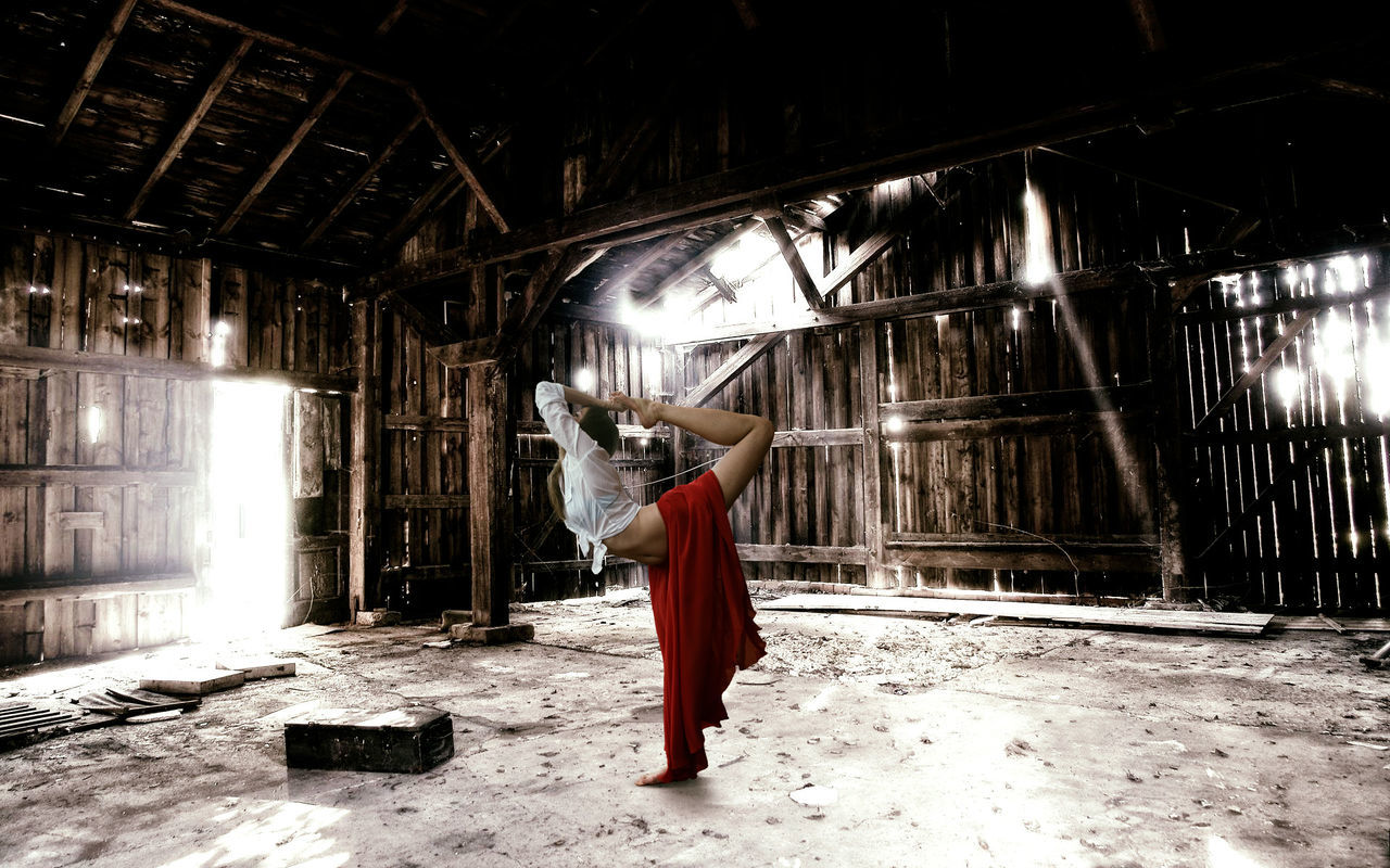 Woman exercising in barn