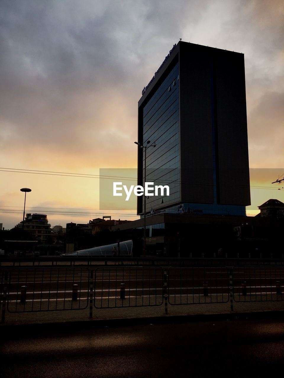 BUILDINGS AGAINST SKY DURING SUNSET