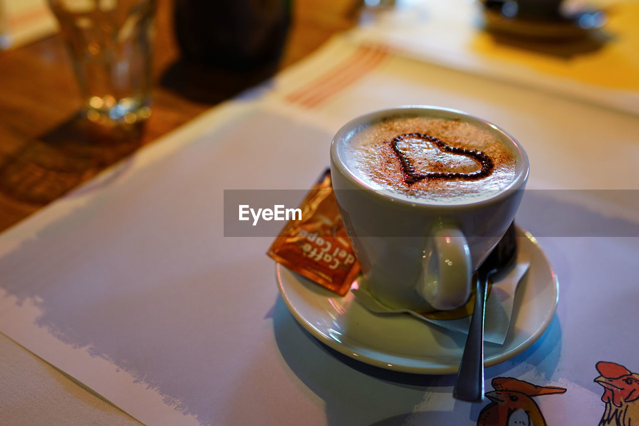 High angle view of coffee cup on restaurant table