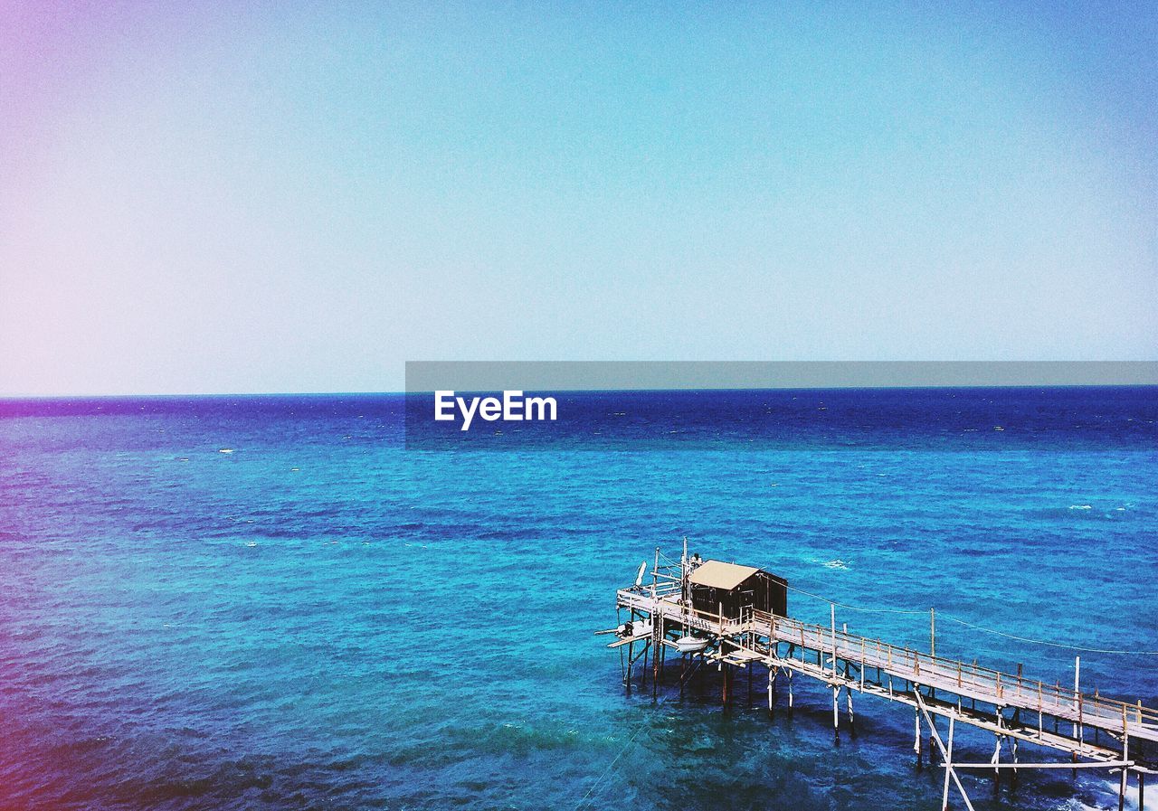 HIGH ANGLE VIEW OF PIER OVER CALM SEA