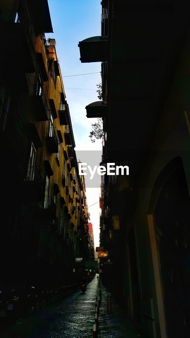 Street amidst residential buildings against sky