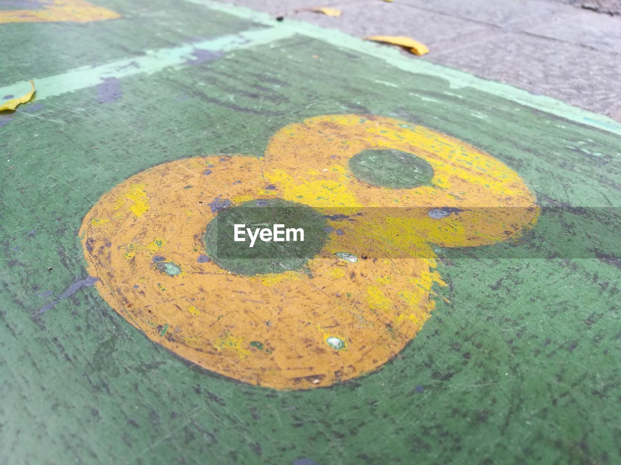 HIGH ANGLE VIEW OF YELLOW PAINTED ON FOOTPATH