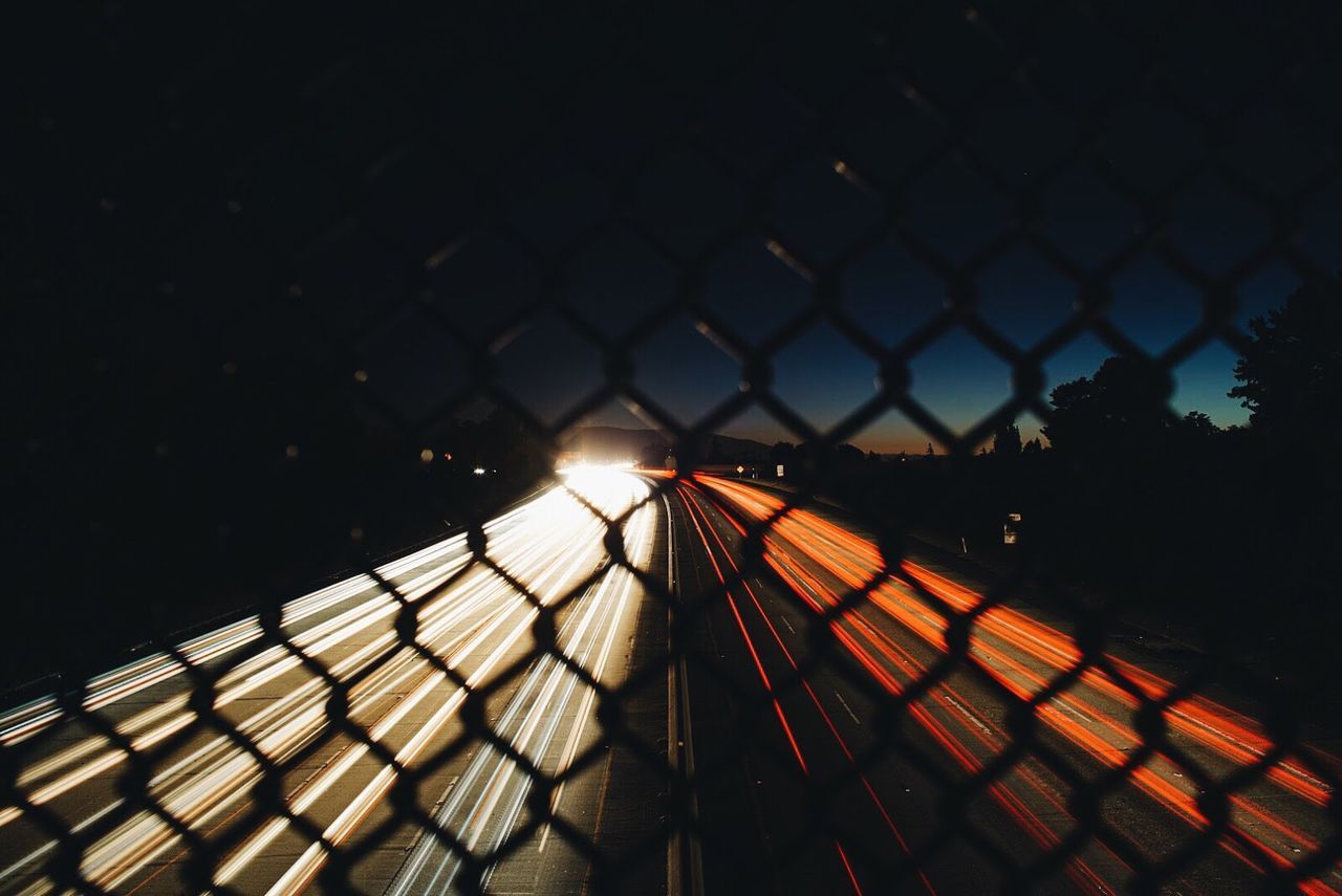 ILLUMINATED CITY AGAINST SKY