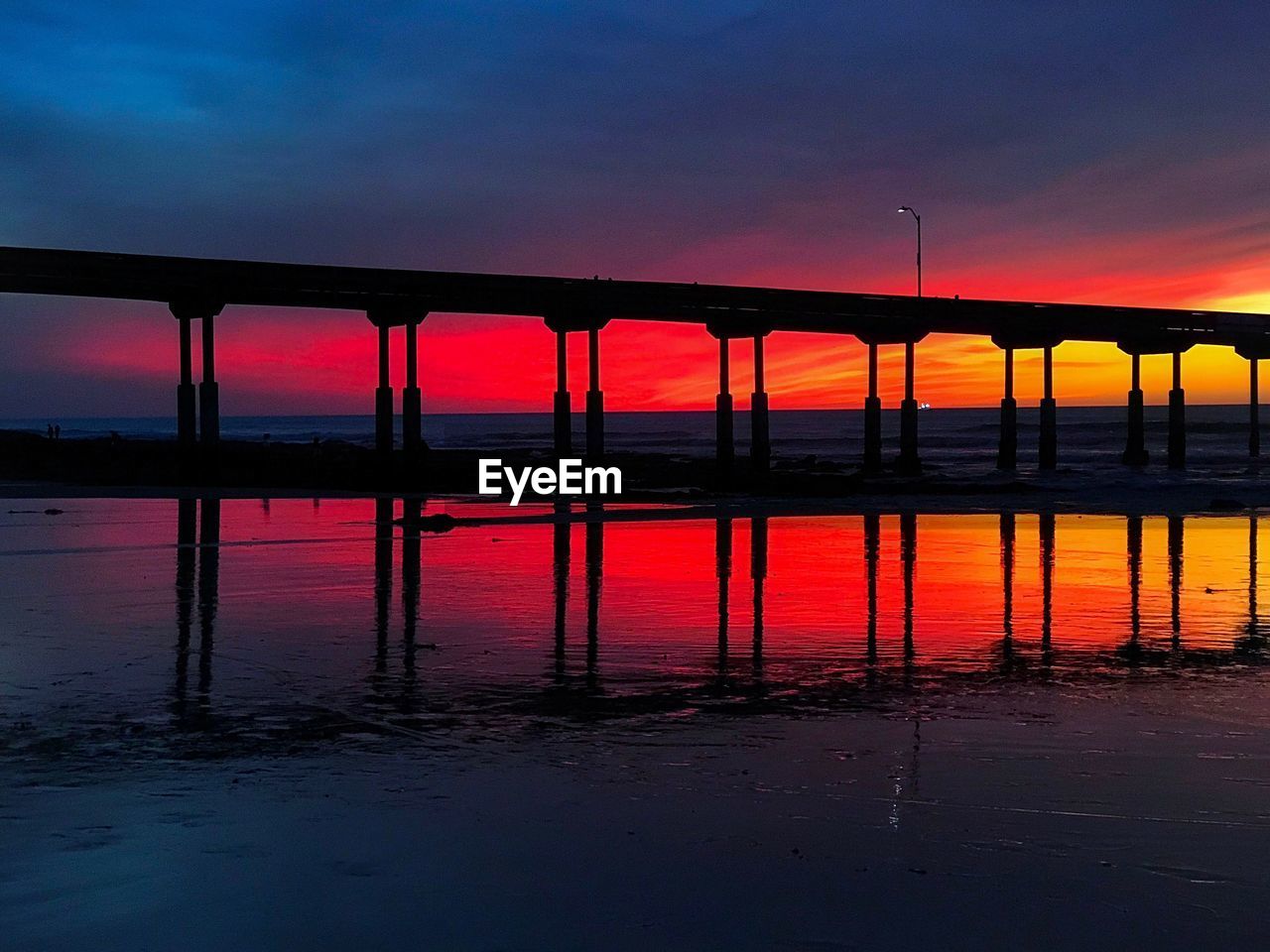 Scenic view of sea against orange sky