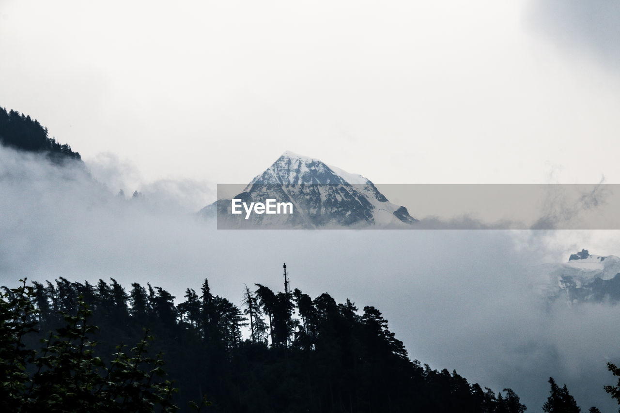 Snowy black mountain top 