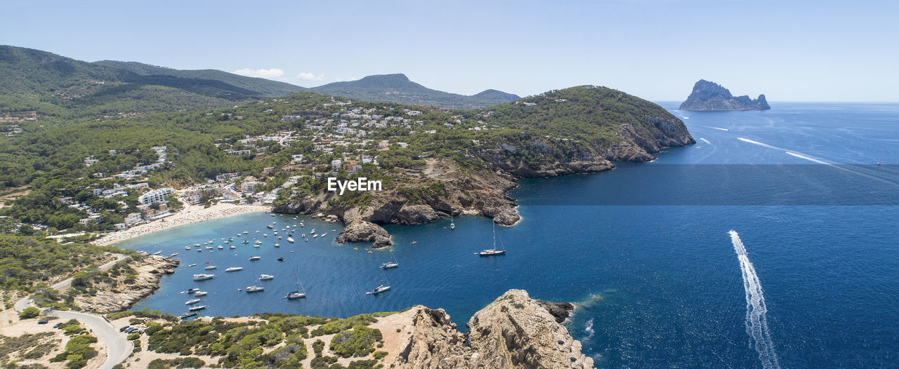 High angle view of sea against clear blue sky