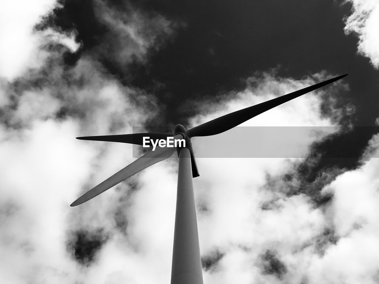 LOW ANGLE VIEW OF WINDMILLS AGAINST SKY