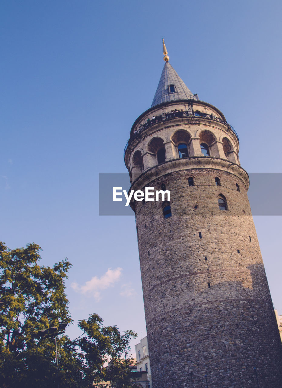 Low angle view of galata tower against sky