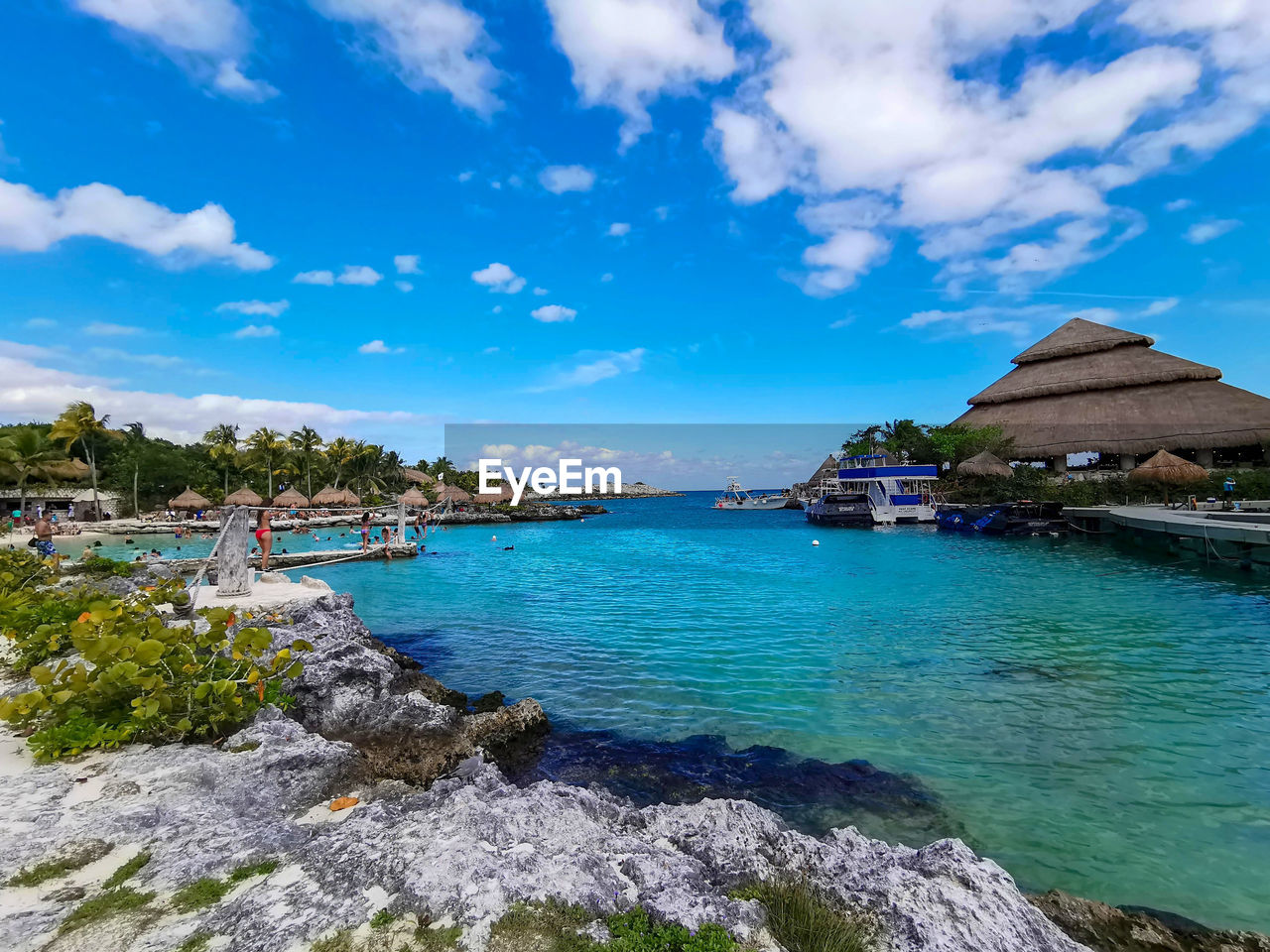 SCENIC VIEW OF SEA AGAINST BUILDINGS