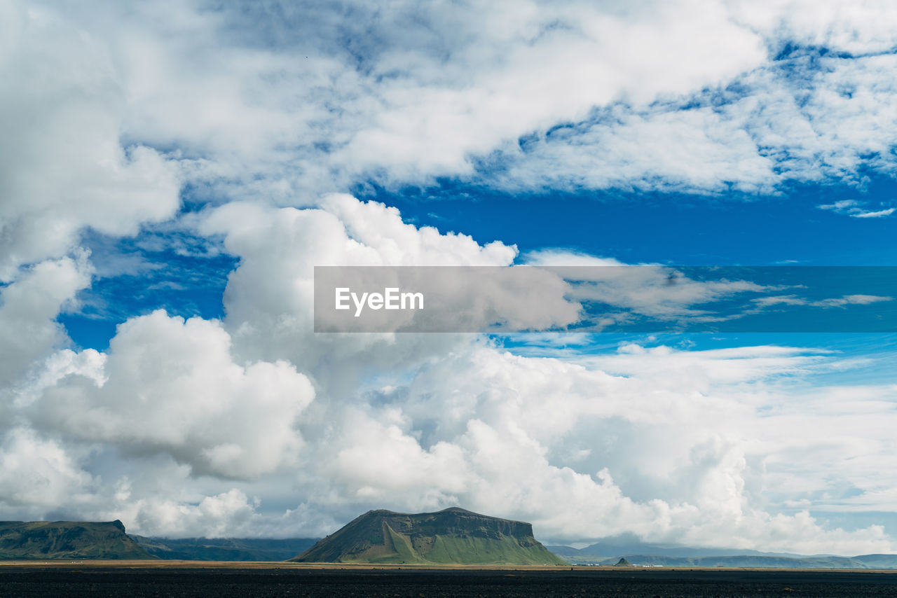 Low angle view of cloudy sky over landscape