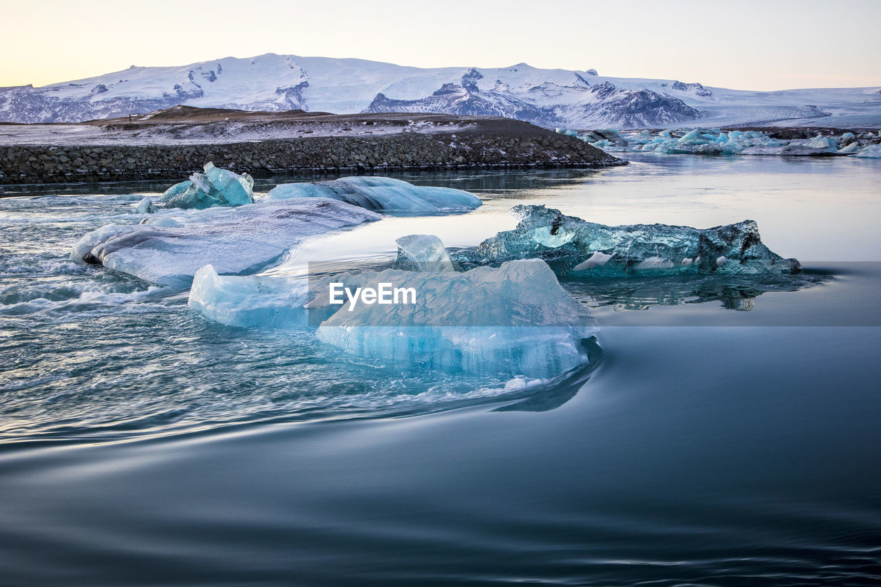 Scenic view of frozen sea against sky, jökulsarlon glacier lagoon, iceland