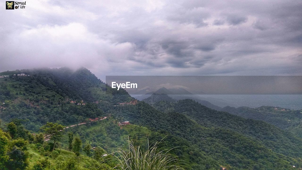 SCENIC VIEW OF GREEN LANDSCAPE AGAINST SKY