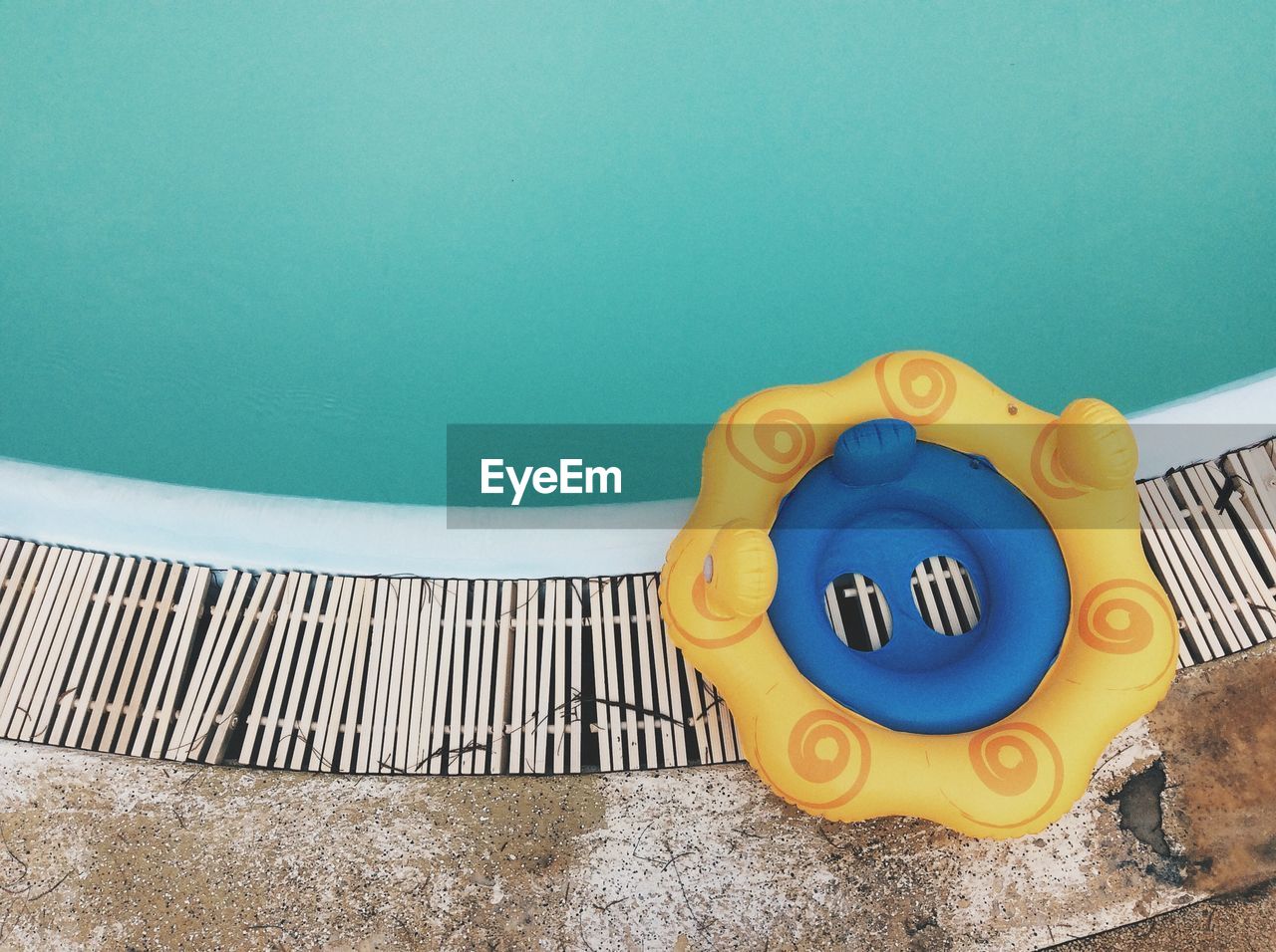 High angle view of inflatable ring on poolside