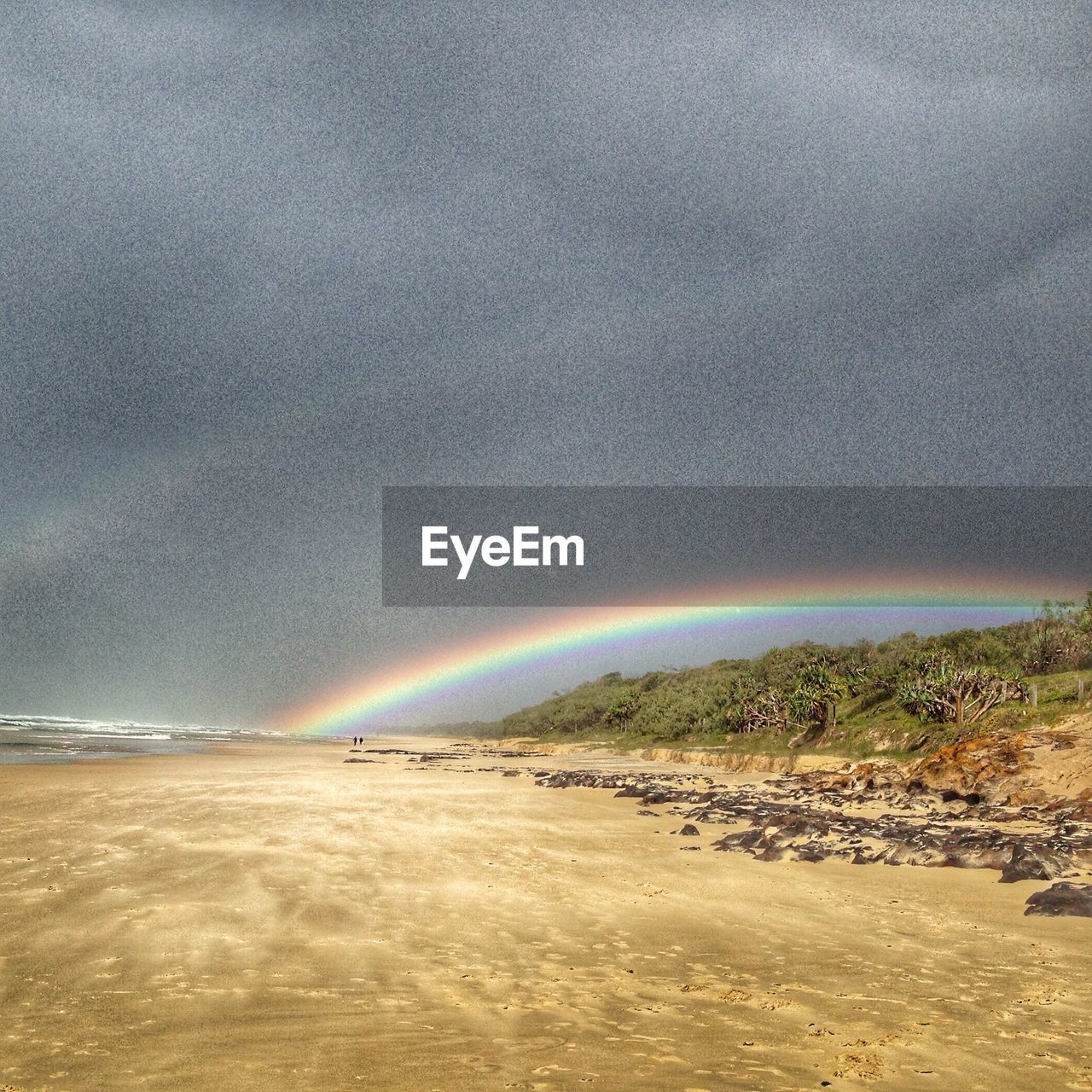 SCENIC VIEW OF RAINBOW OVER ROAD