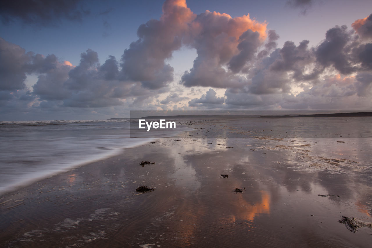 Scenic view of sea against sky at sunset