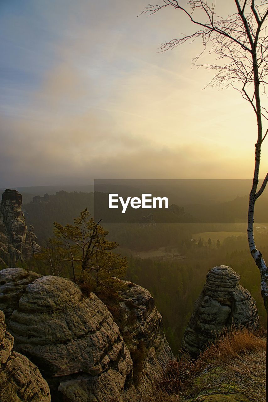 Scenic view of landscape against sky during sunset