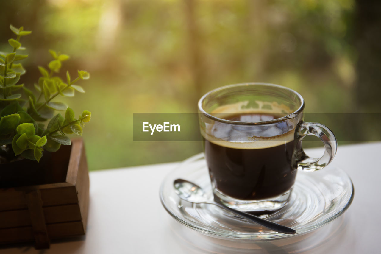 Close-up of coffee cup in saucer on table