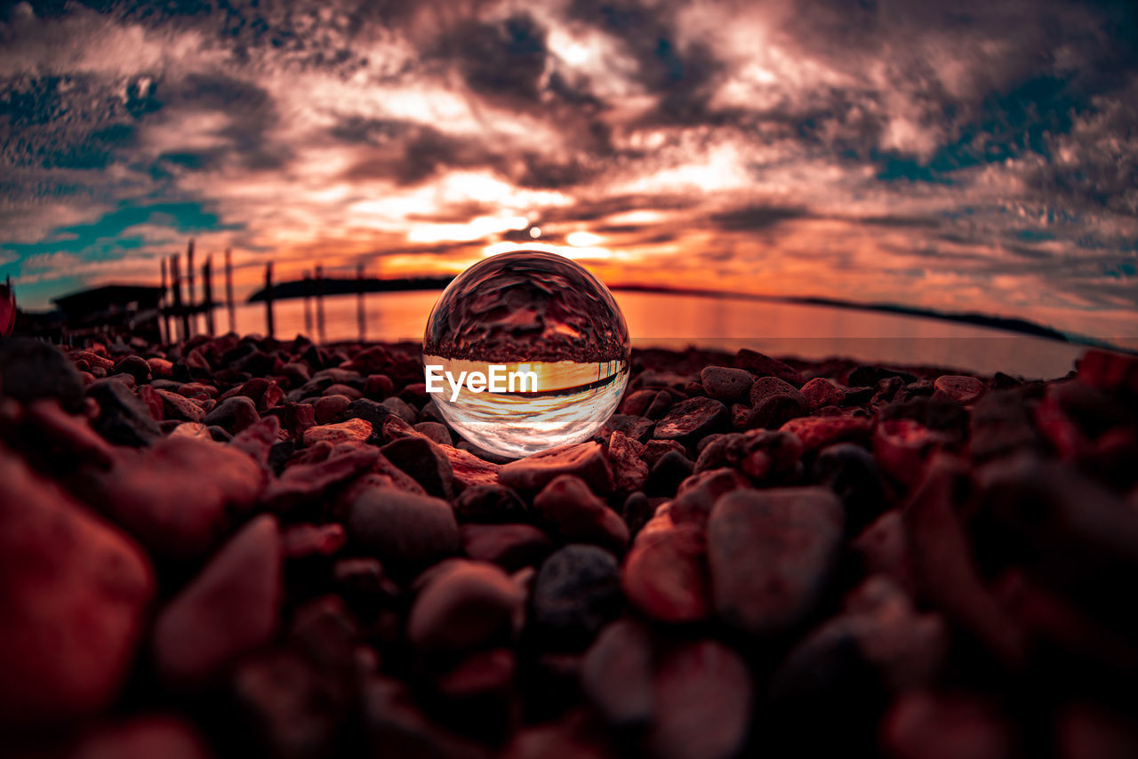 Lensball photographed on the rocks 