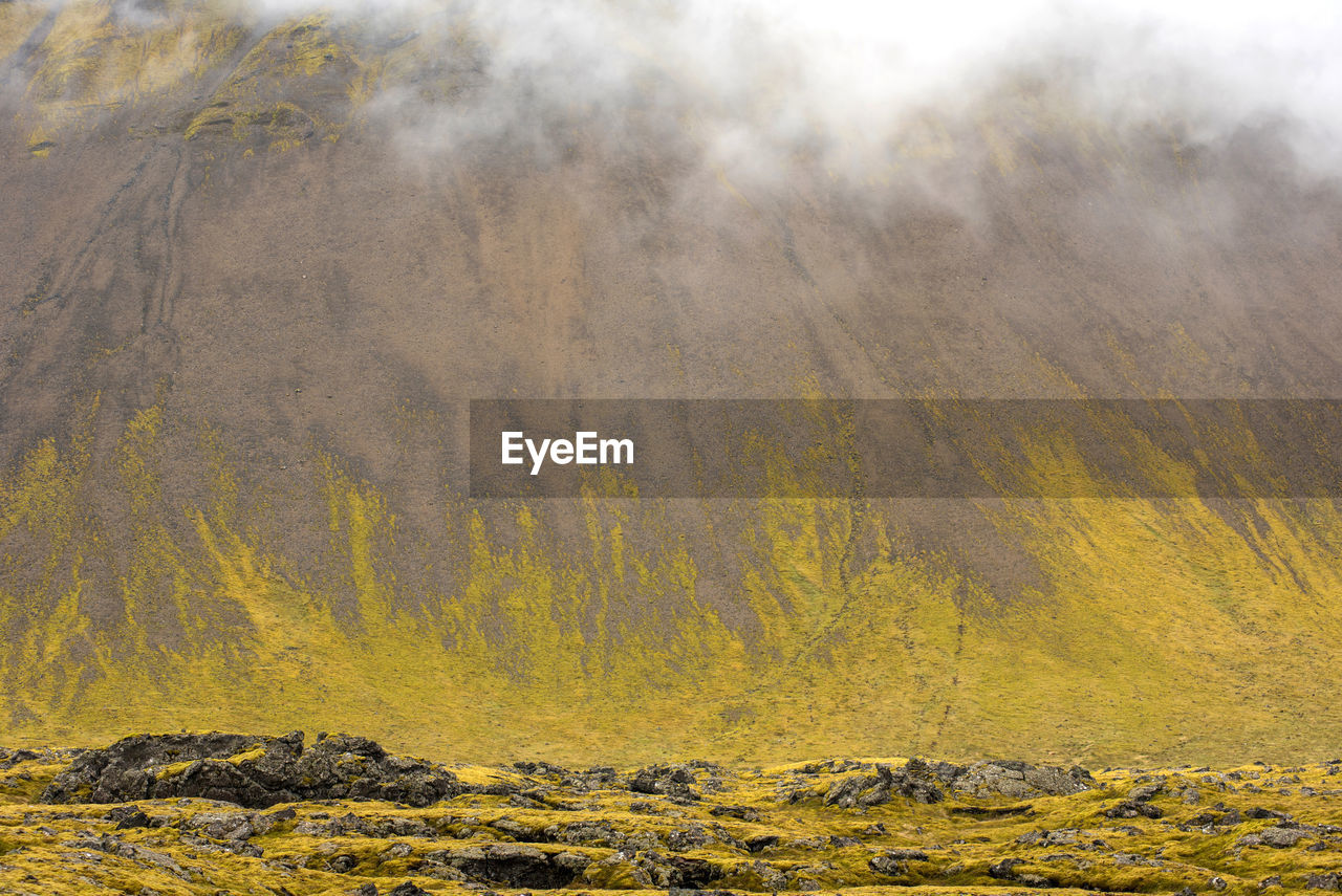 Scenic view of mountain during foggy weather