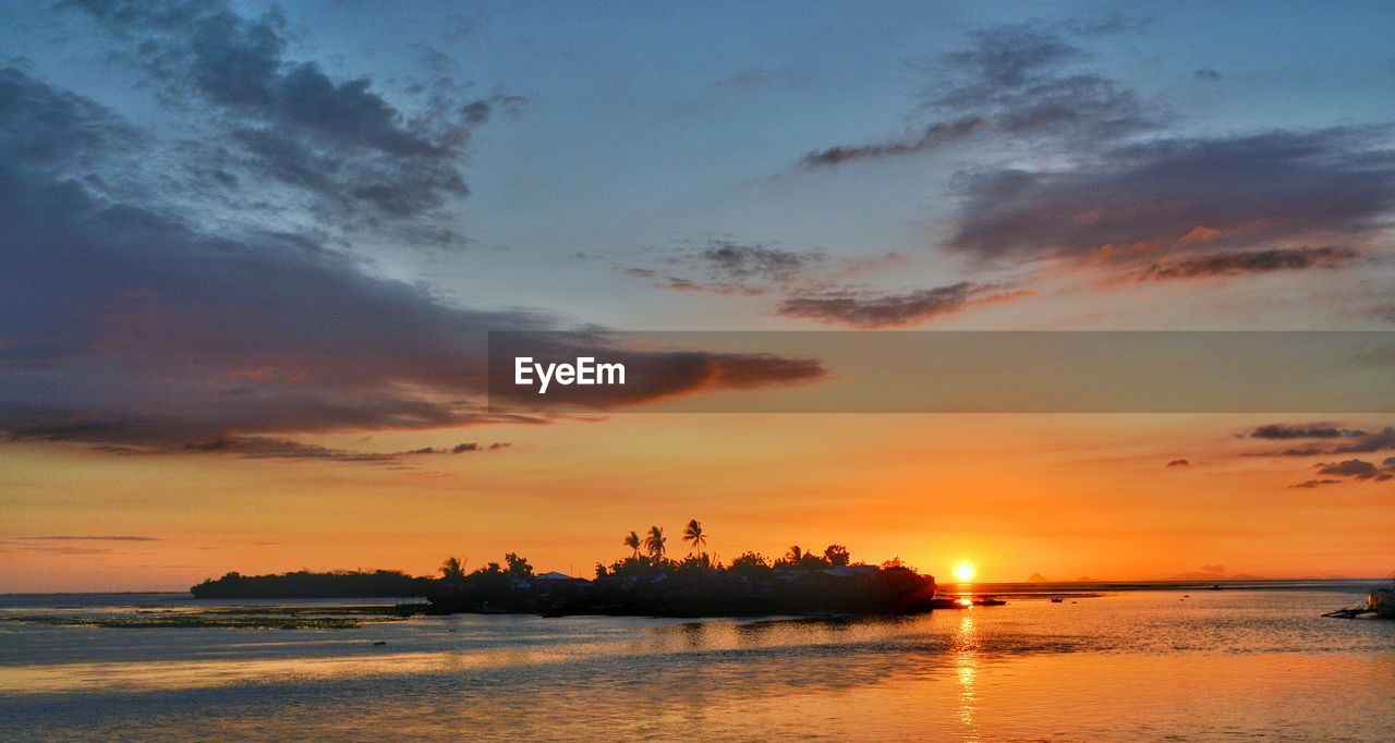 SCENIC VIEW OF SEA DURING SUNSET