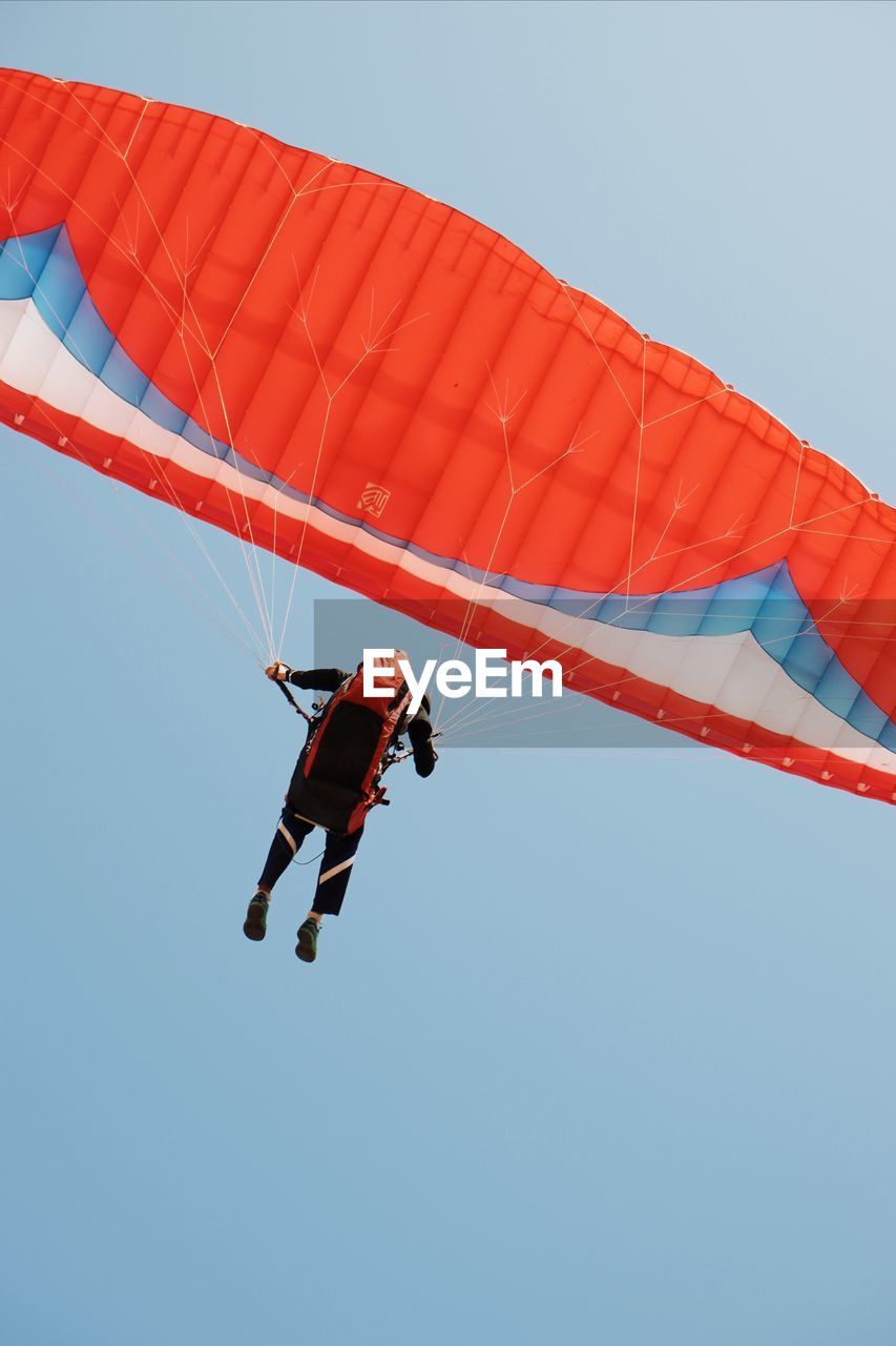 LOW ANGLE VIEW OF PARAGLIDING AGAINST SKY