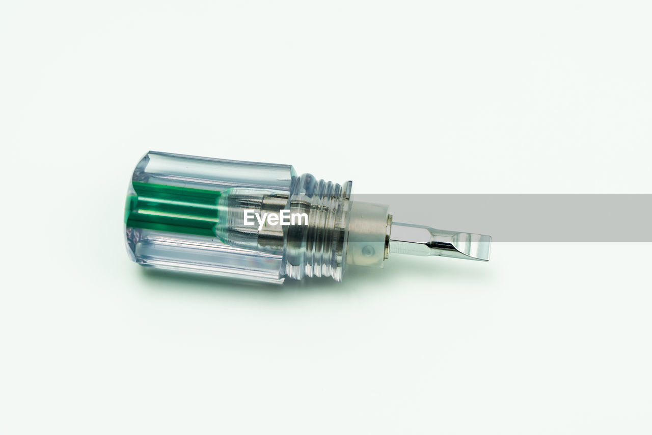 High angle view of screwdriver on white background