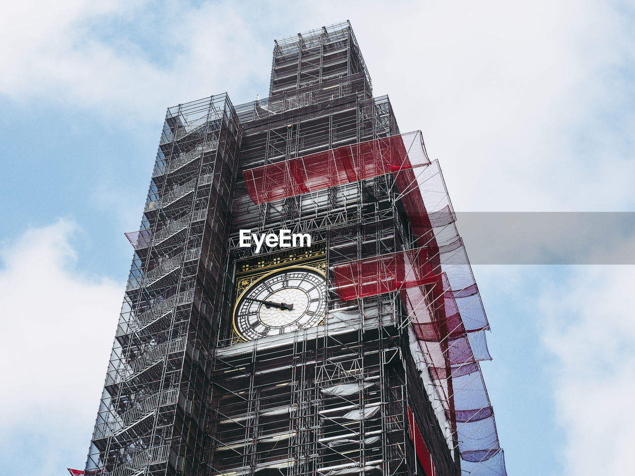 LOW ANGLE VIEW OF CLOCK TOWER IN CITY