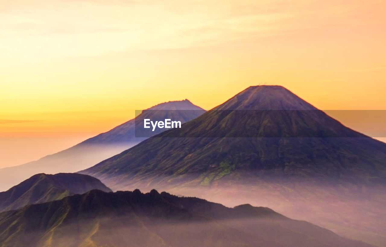 VIEW OF VOLCANIC MOUNTAIN DURING SUNSET
