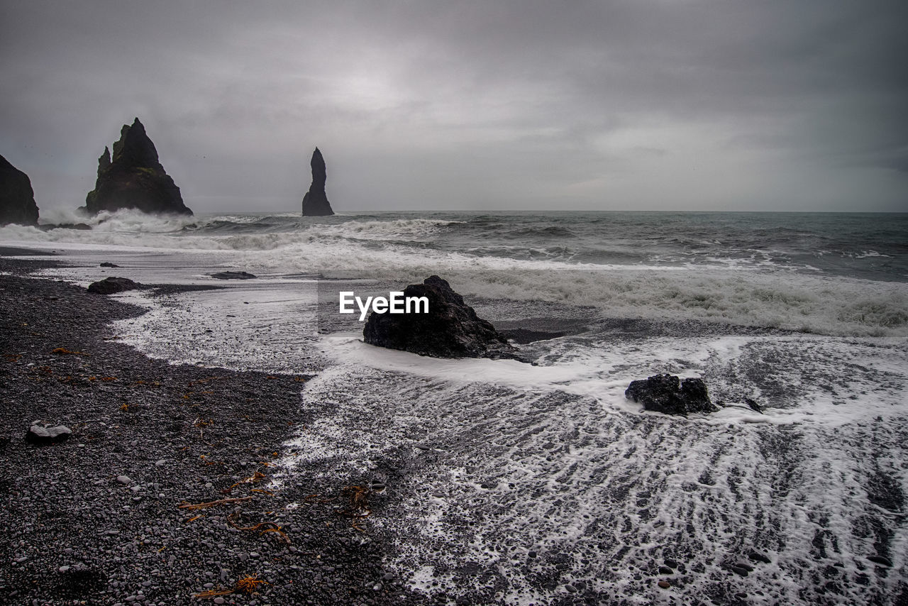 Scenic view of beach against sky