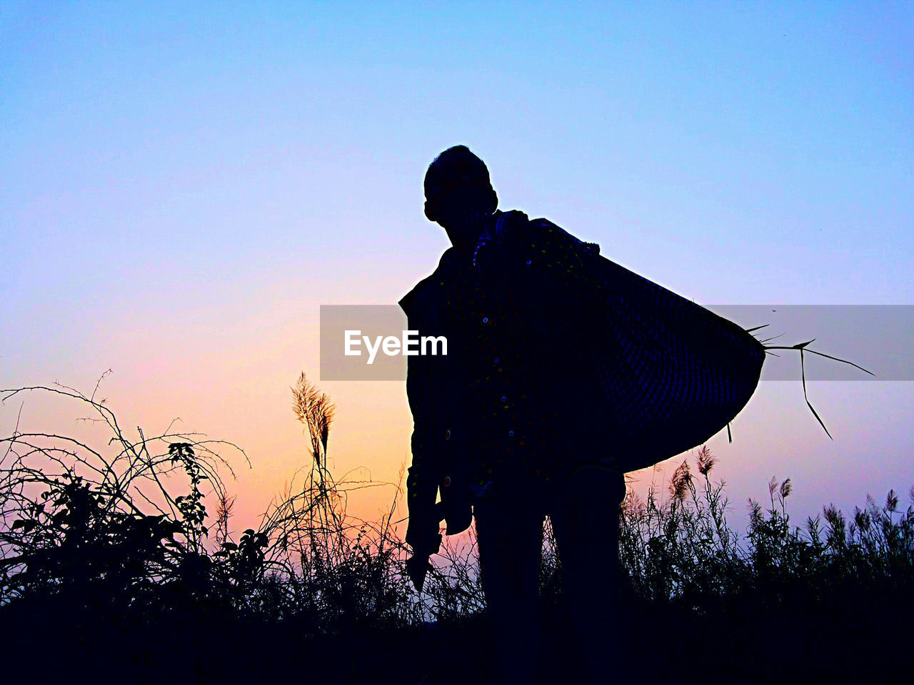 Silhouette man standing against clear sky