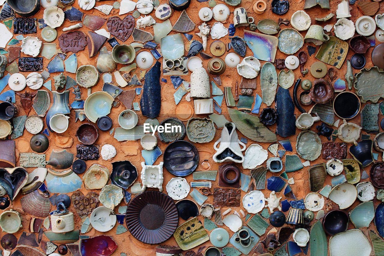 Full frame shot of pottery pieces on table