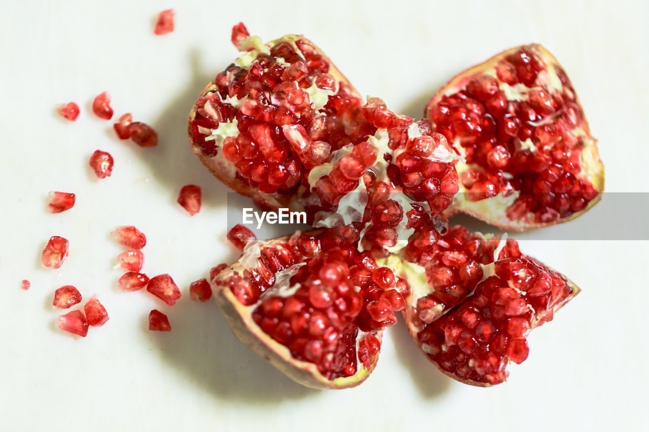 Close-up of pomegranate on white background