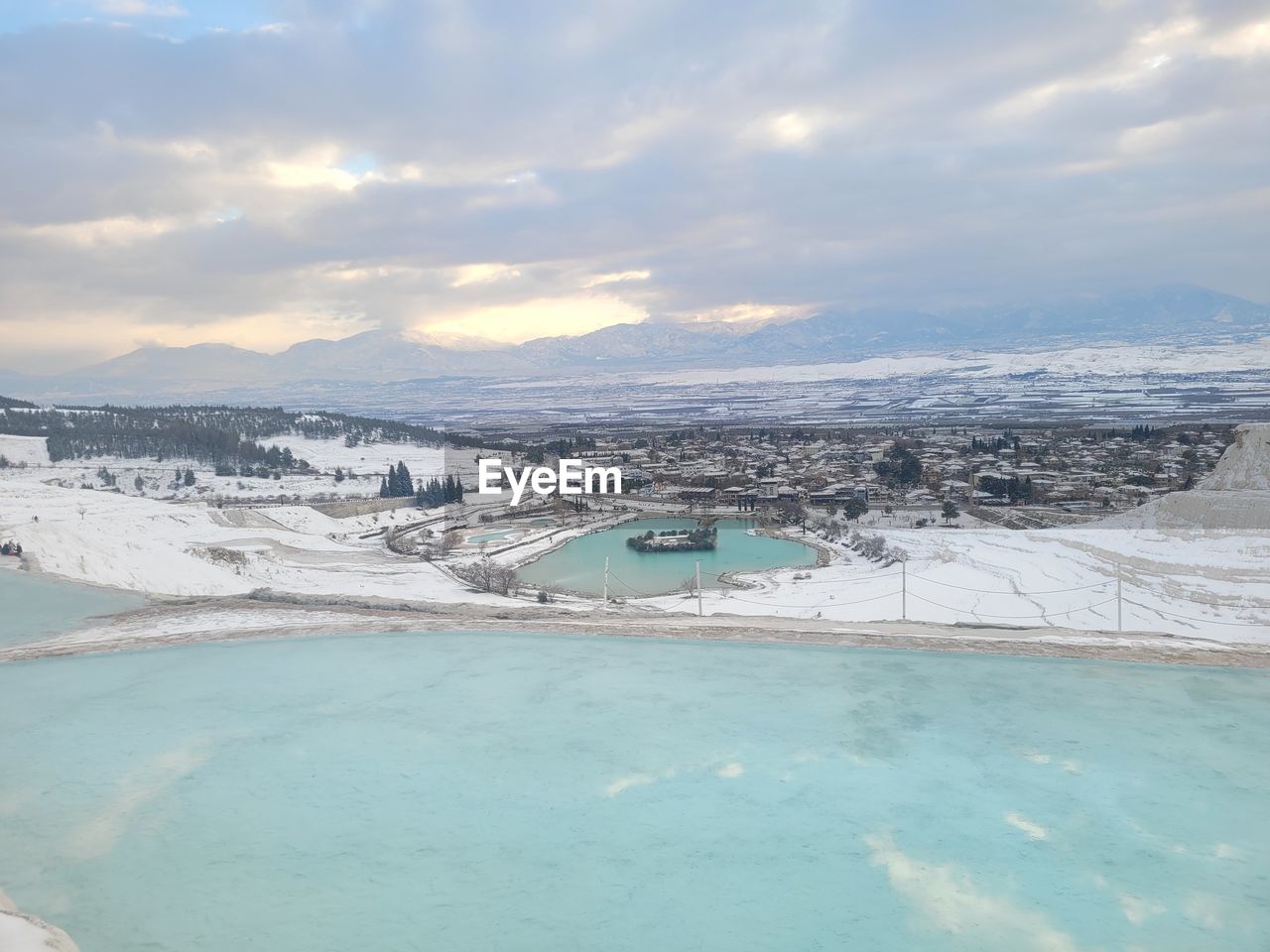 water, sky, ice, cold temperature, nature, cloud, winter, snow, scenics - nature, environment, beauty in nature, sea, travel destinations, travel, landscape, land, lagoon, no people, mountain, tranquility, frozen, ocean, day, outdoors, tourism, blue, tranquil scene, wave, architecture, vacation