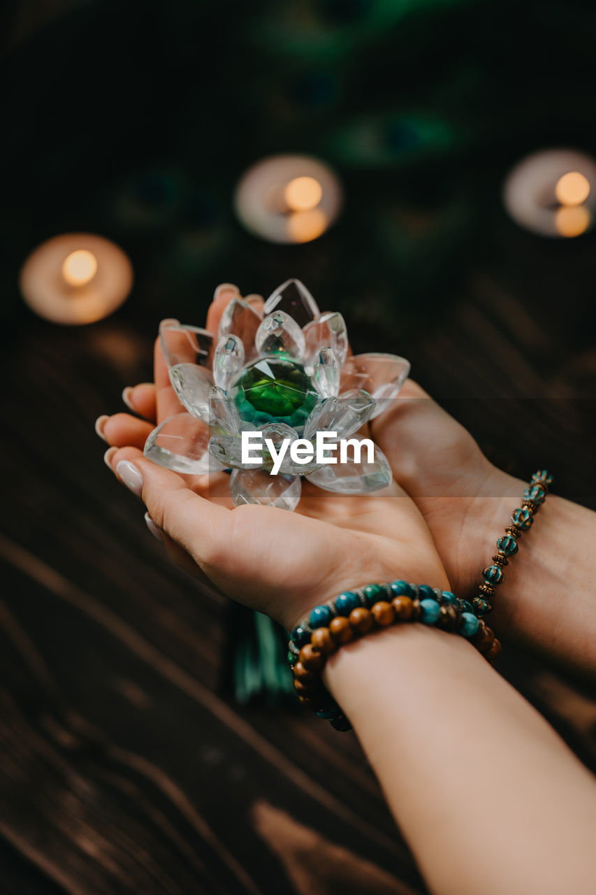 cropped hand of woman holding christmas decoration