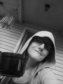 Portrait of woman with coffee cup against building