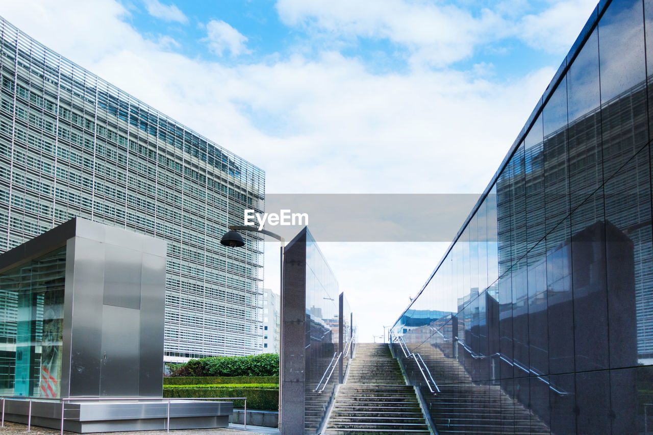 Low angle view of modern buildings against sky in city