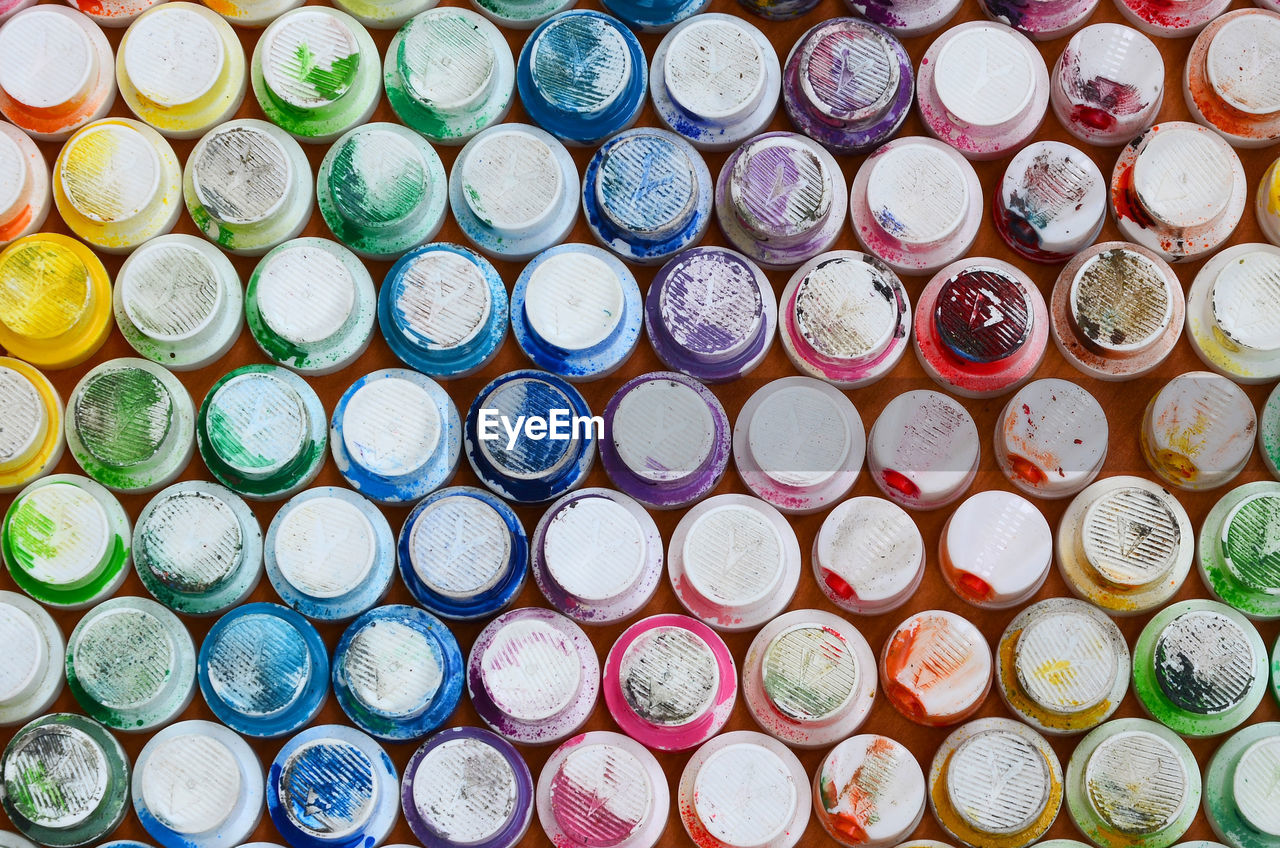 Full frame shot of colorful spray cans