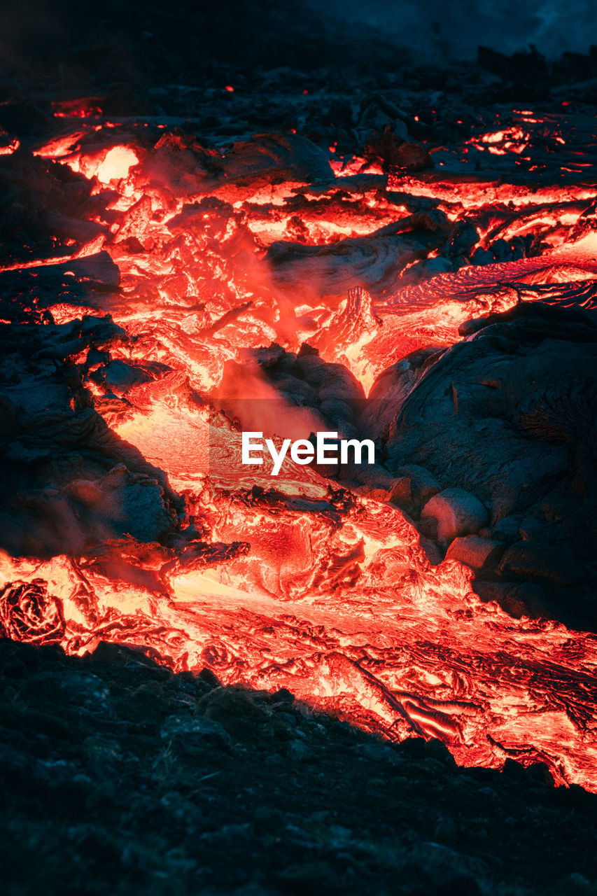 Atmospheric close-up view of flowing lava at volcano eruption site, geldingadalir, iceland