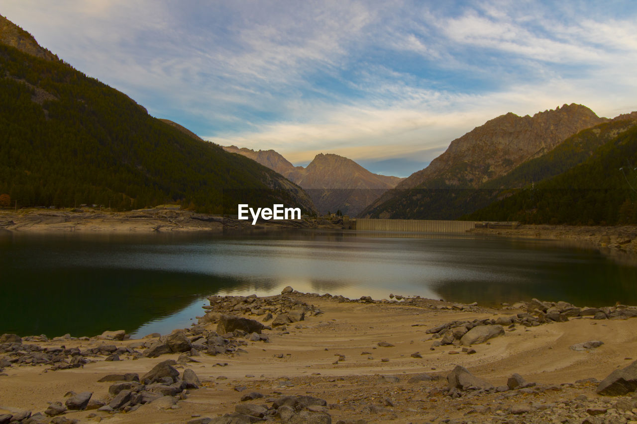 Scenic view of lake and mountains against sky