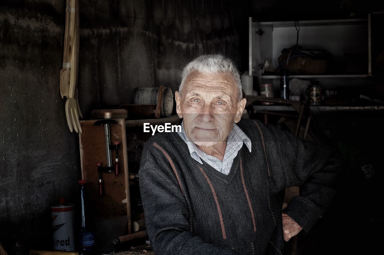 Portrait of senior man in workshop