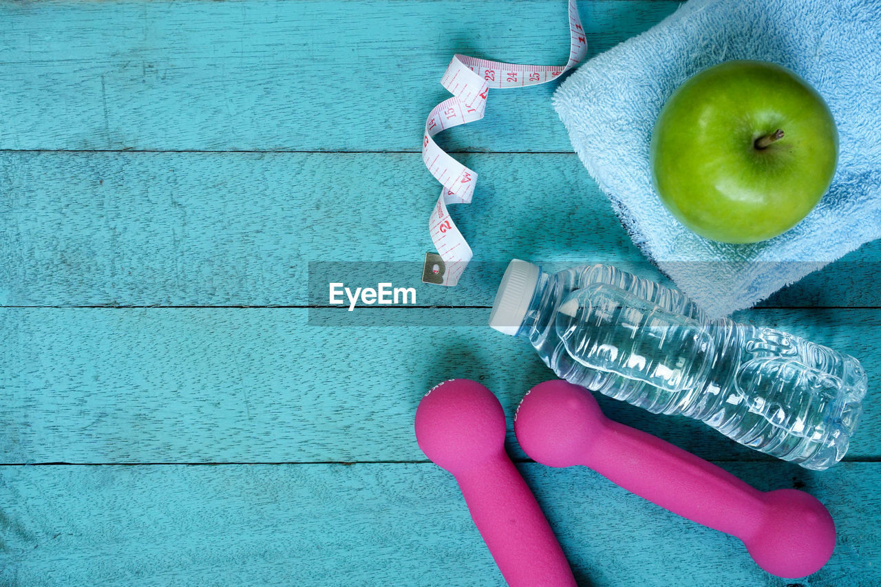 Close-up of exercise equipment on blue table