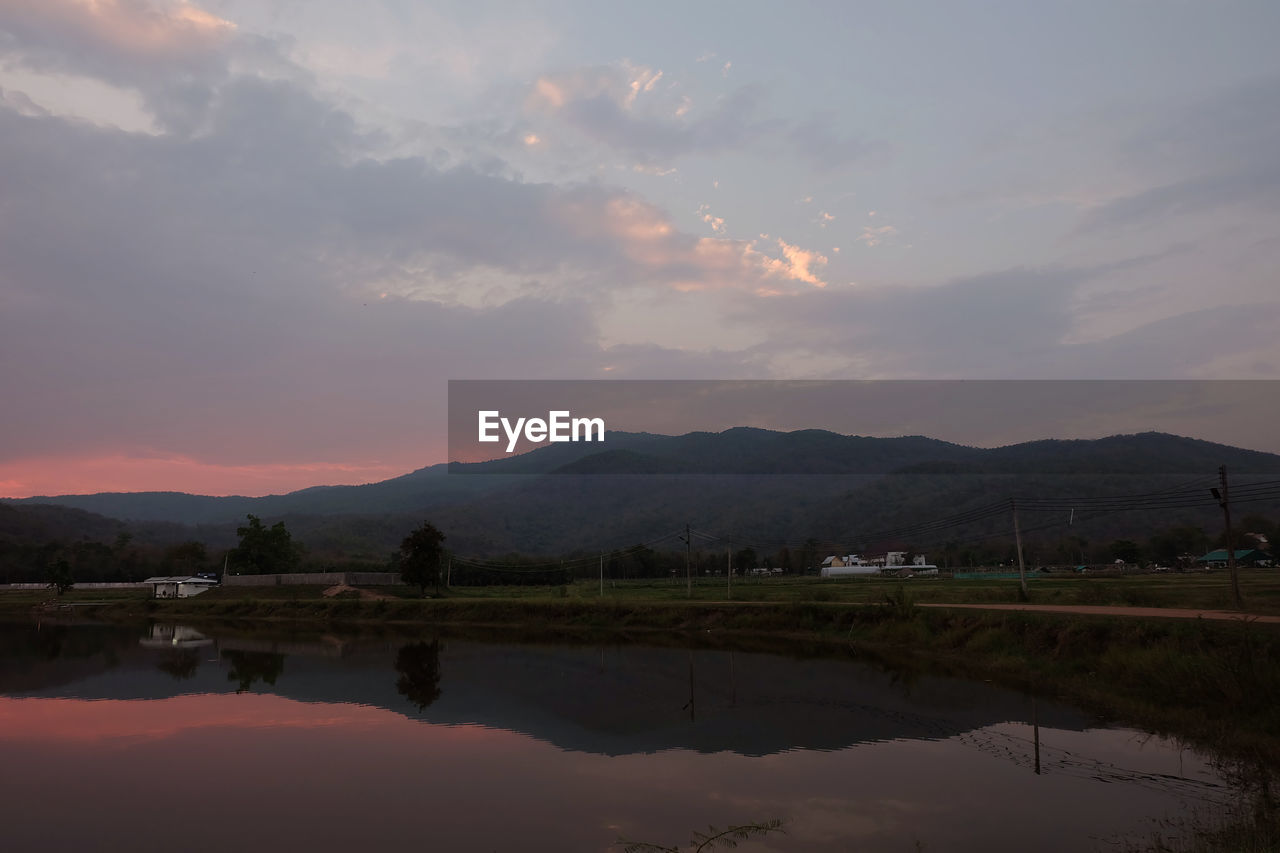 Scenic view of lake against sky during sunset