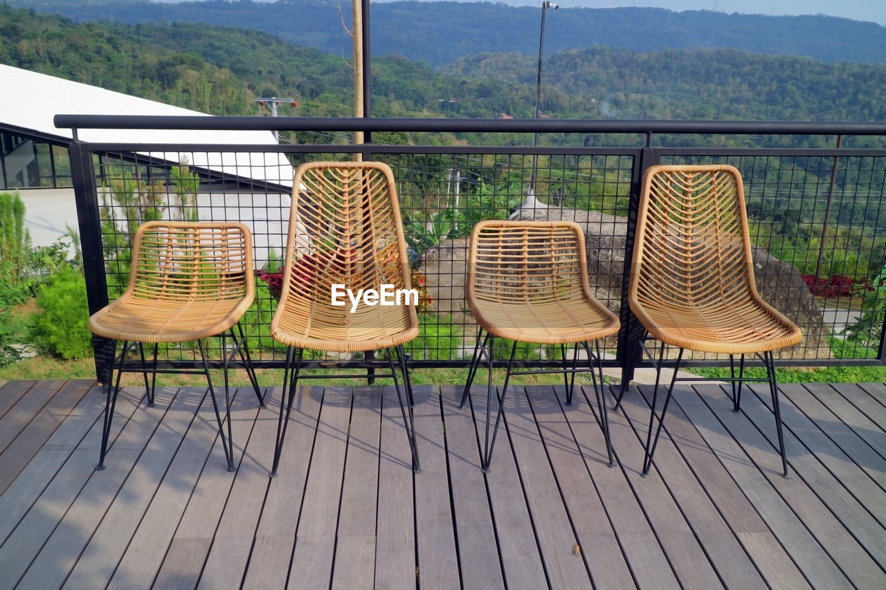 Four chairs made of woven wood photo