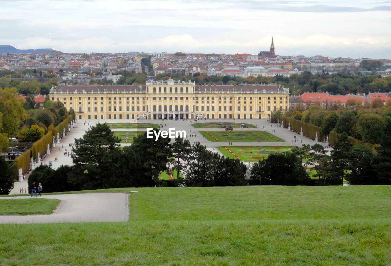 VIEW OF TREES AND BUILDINGS AGAINST SKY