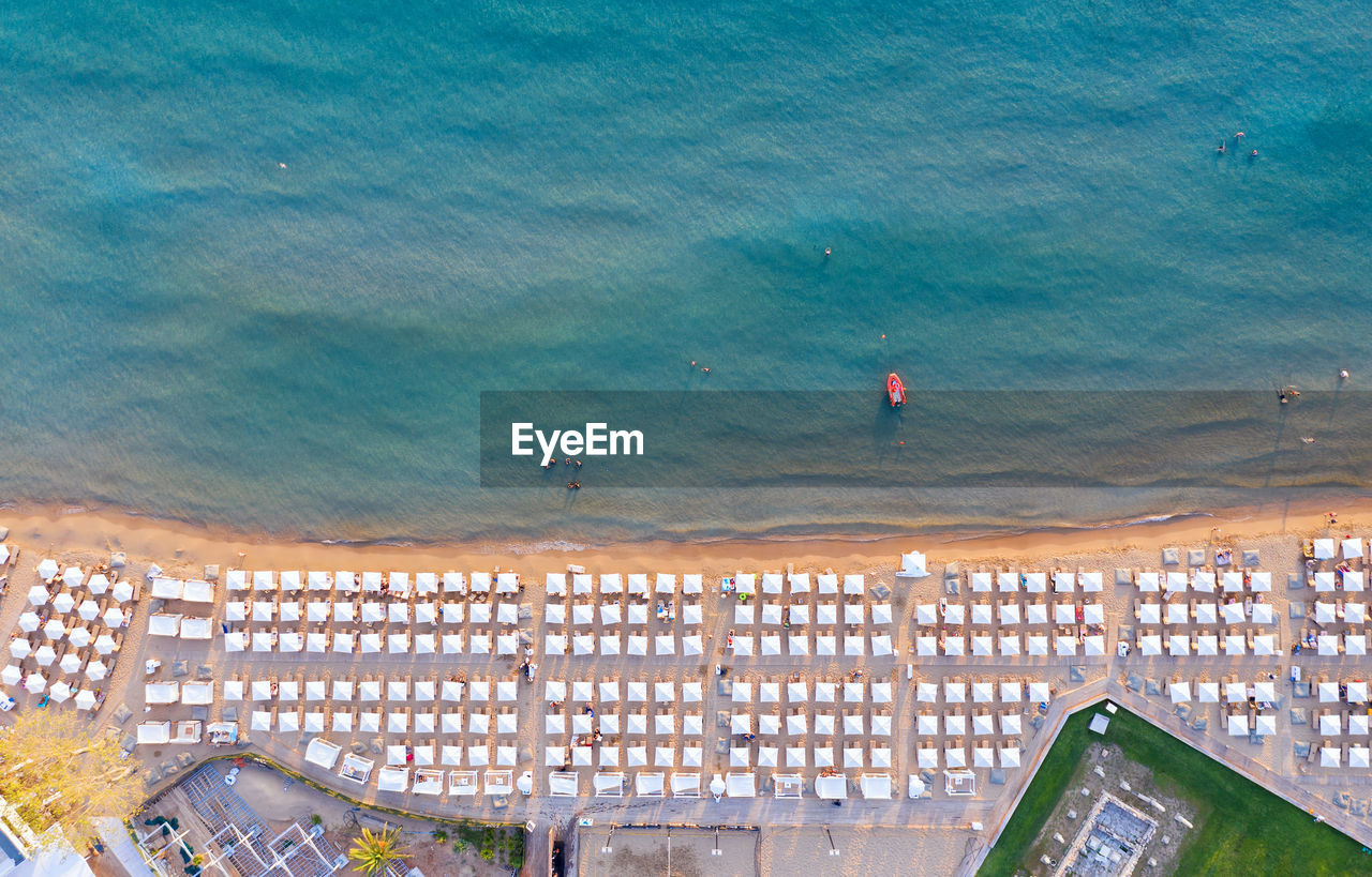 Aerial view of parasols arranged at beach