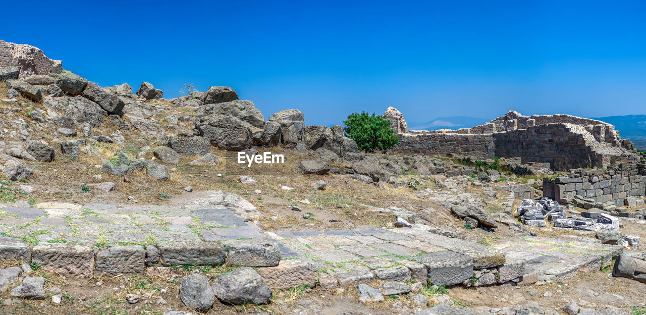 Rock formation against clear blue sky